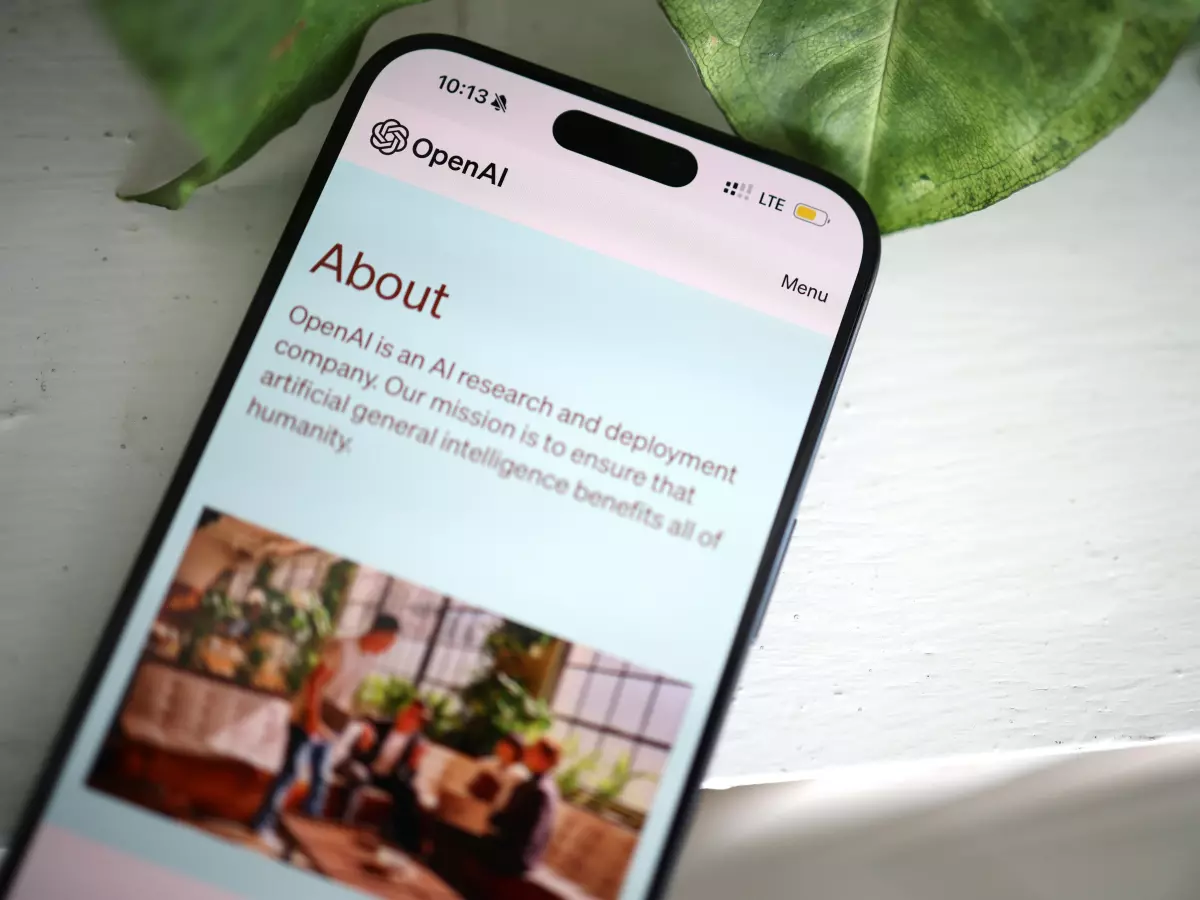 A smartphone displaying the OpenAI website with a picture of a group of people sitting around a table.