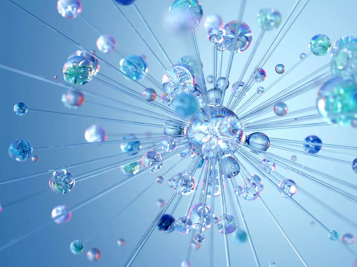 A blue background with a central sphere surrounded by many smaller spheres, with light rays emanating outward.