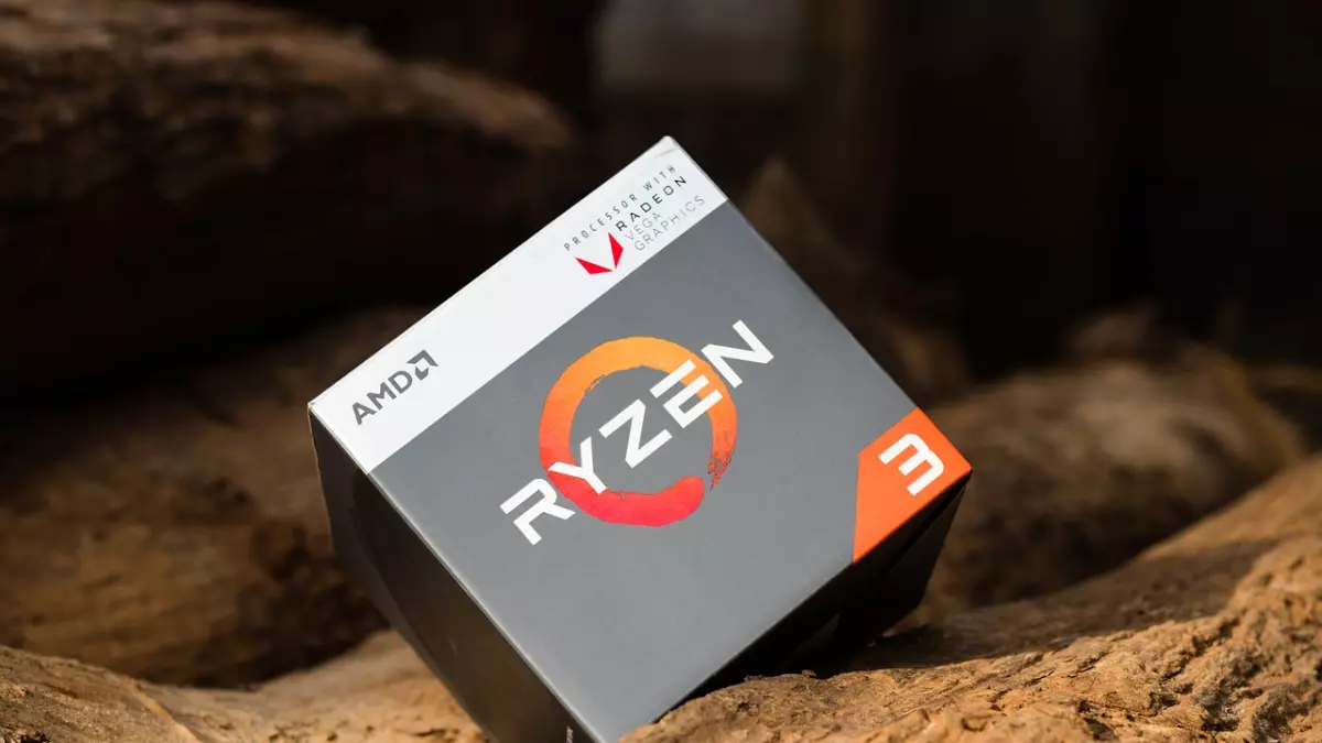 A close-up of a AMD Ryzen 3 CPU box on a wooden surface