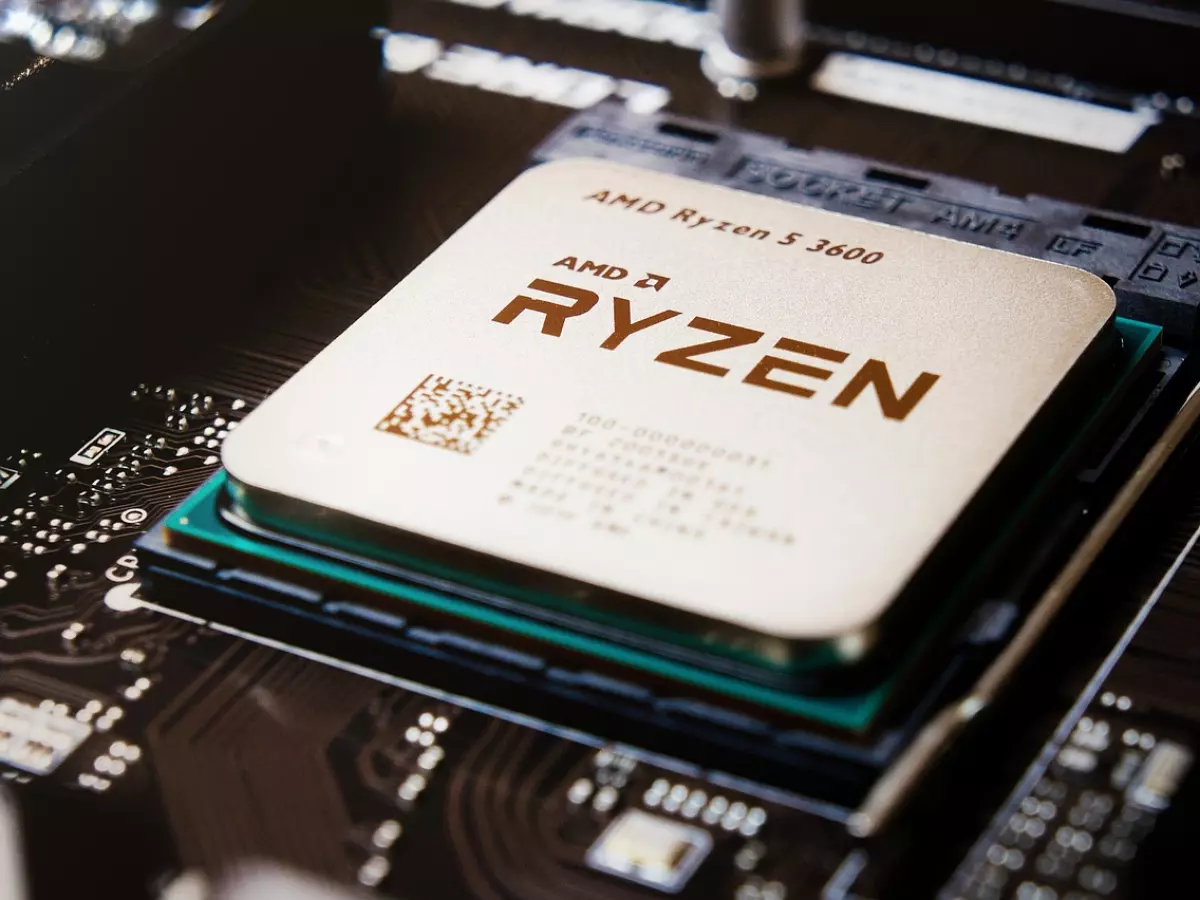 A close-up photo of an AMD Ryzen CPU on a motherboard.