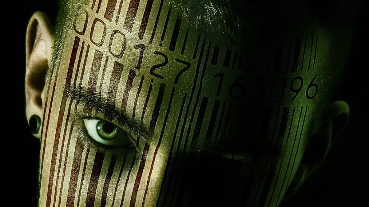 A man with a barcode on his face looking at the camera.