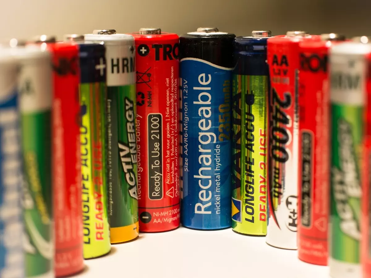 A close-up view of different types of batteries, including AA, AAA, and 9V.