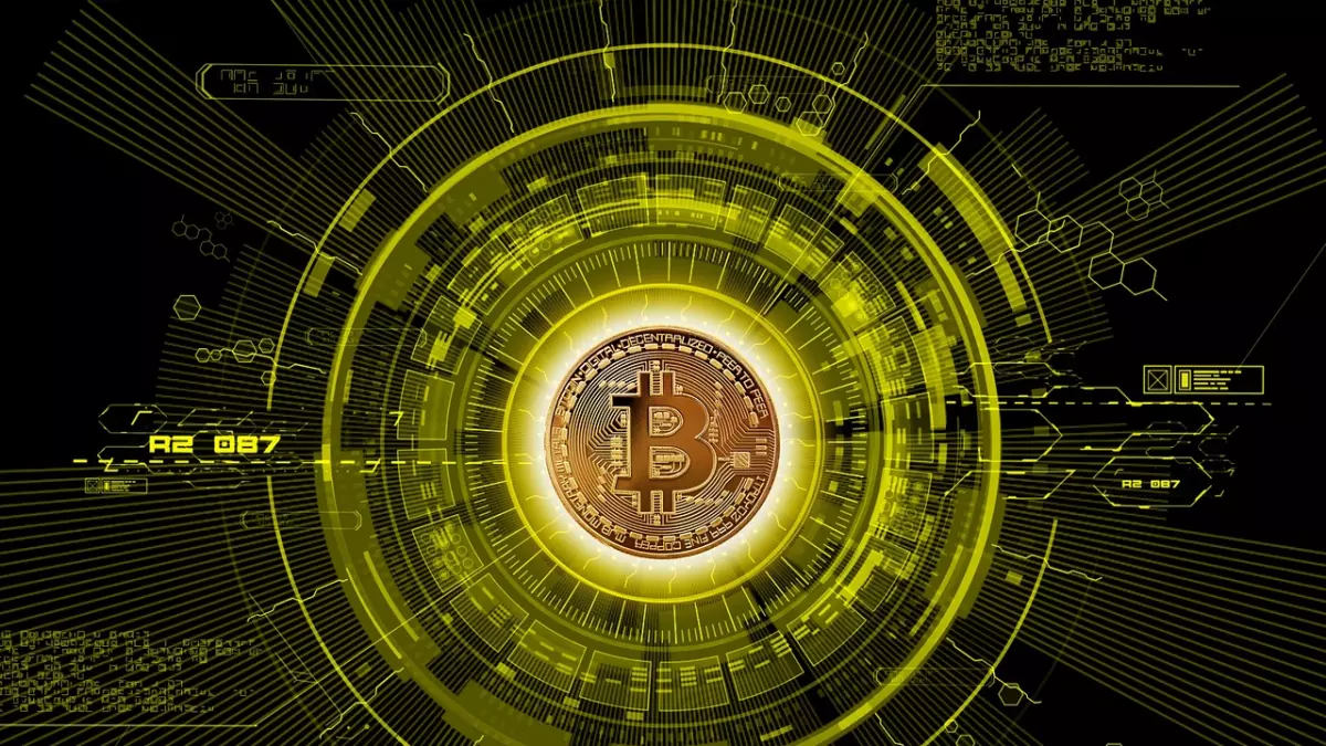 A single Bitcoin coin is placed at the center of a futuristic, circular, digital interface, surrounded by glowing lines and patterns that radiate outwards. The coin is the focal point, radiating a golden hue against a black background.