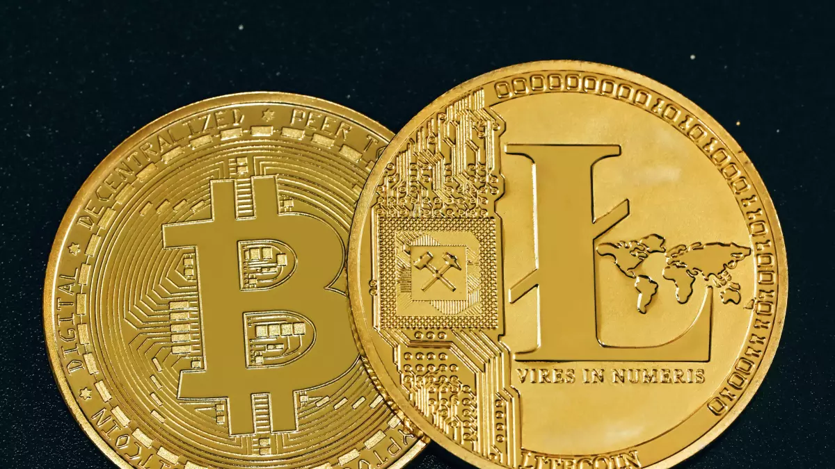 Two gold coins with different symbols, one with a Bitcoin symbol and the other with a Litecoin symbol, against a black background.