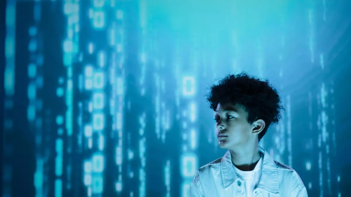 A person standing in front of a swirling tunnel of blue binary code.