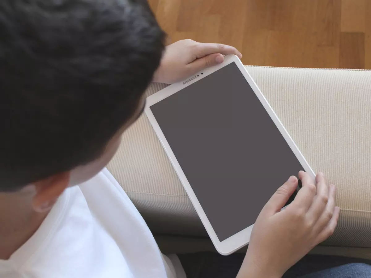 A hand is holding a sticky note with 'WIFI' written on it, suggesting expanded WiFi coverage across the home.