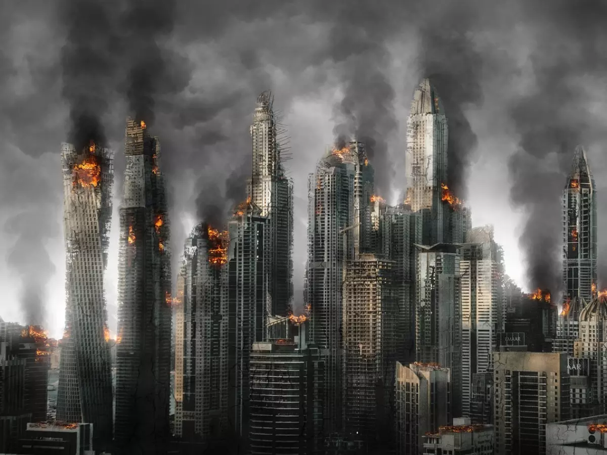 A city skyline with tall skyscrapers engulfed in flames and smoke.