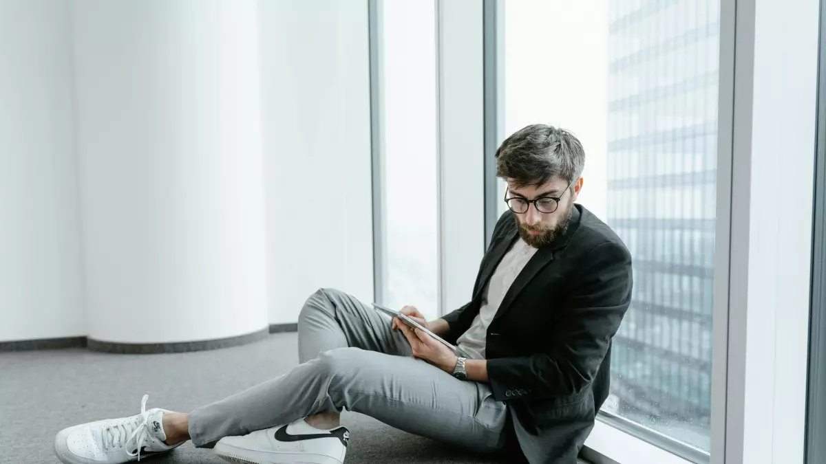 A man holding a phone with a blockchain app open.