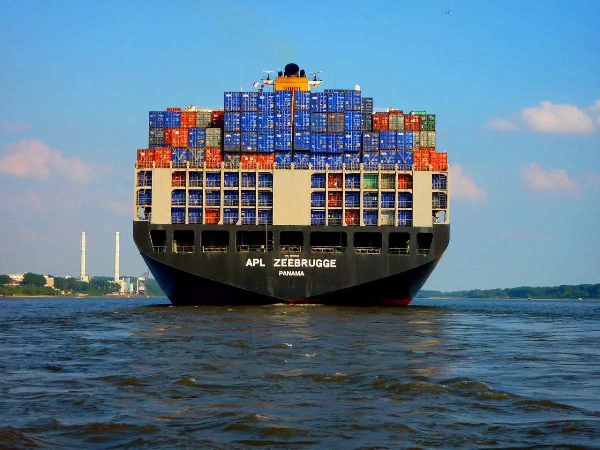 A large container ship sailing on the water. 