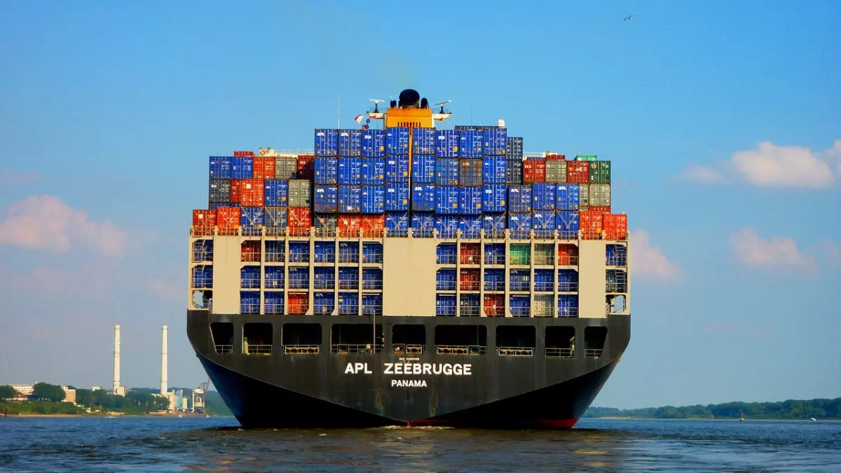 A large container ship sailing on the water. 