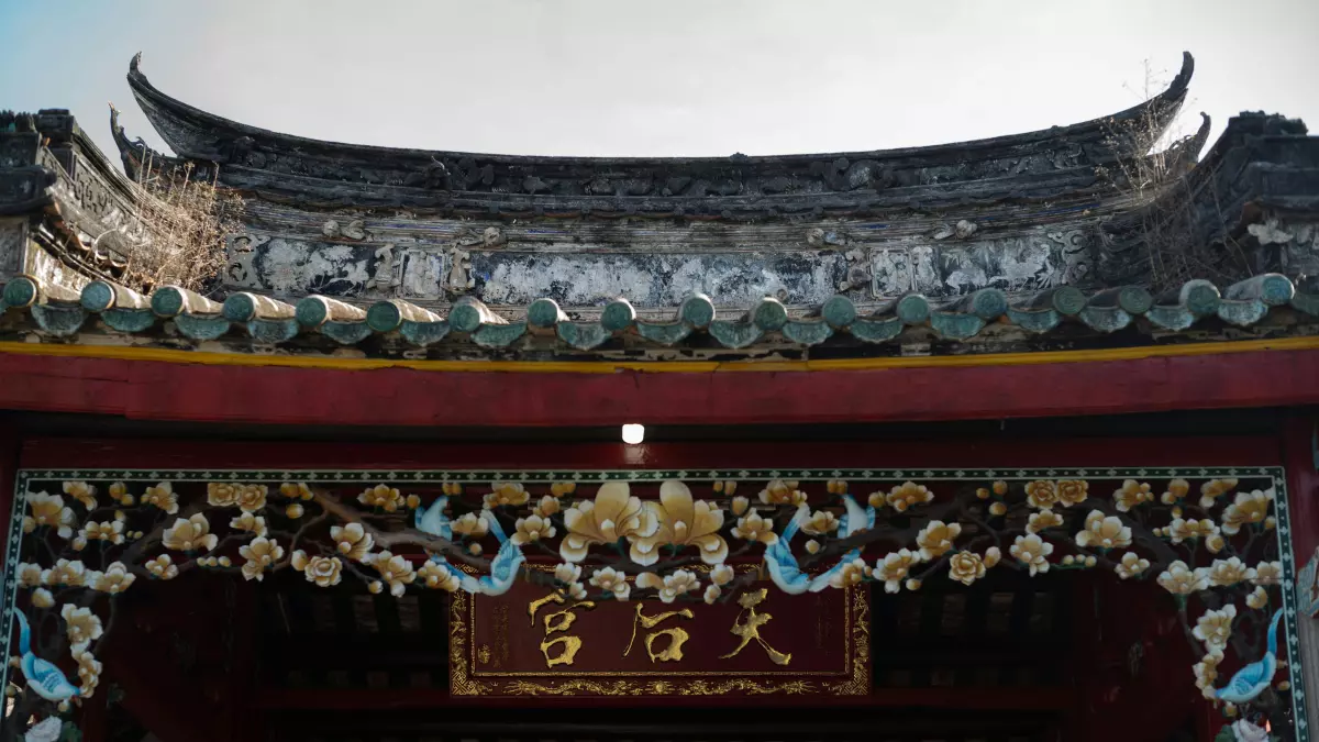 A close-up of the roof of a temple, with intricate details and a sense of grandeur.