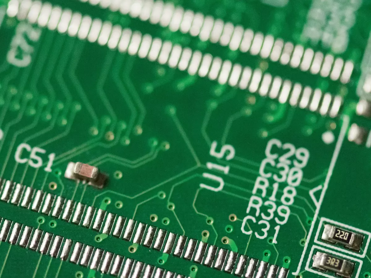 Close-up of a green circuit board with various components.