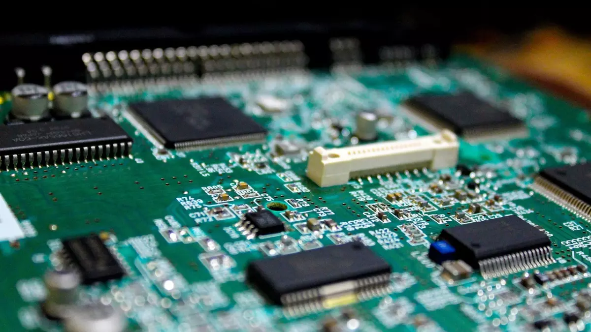 A close-up shot of a circuit board, showcasing the intricate network of chips, wires, and components.