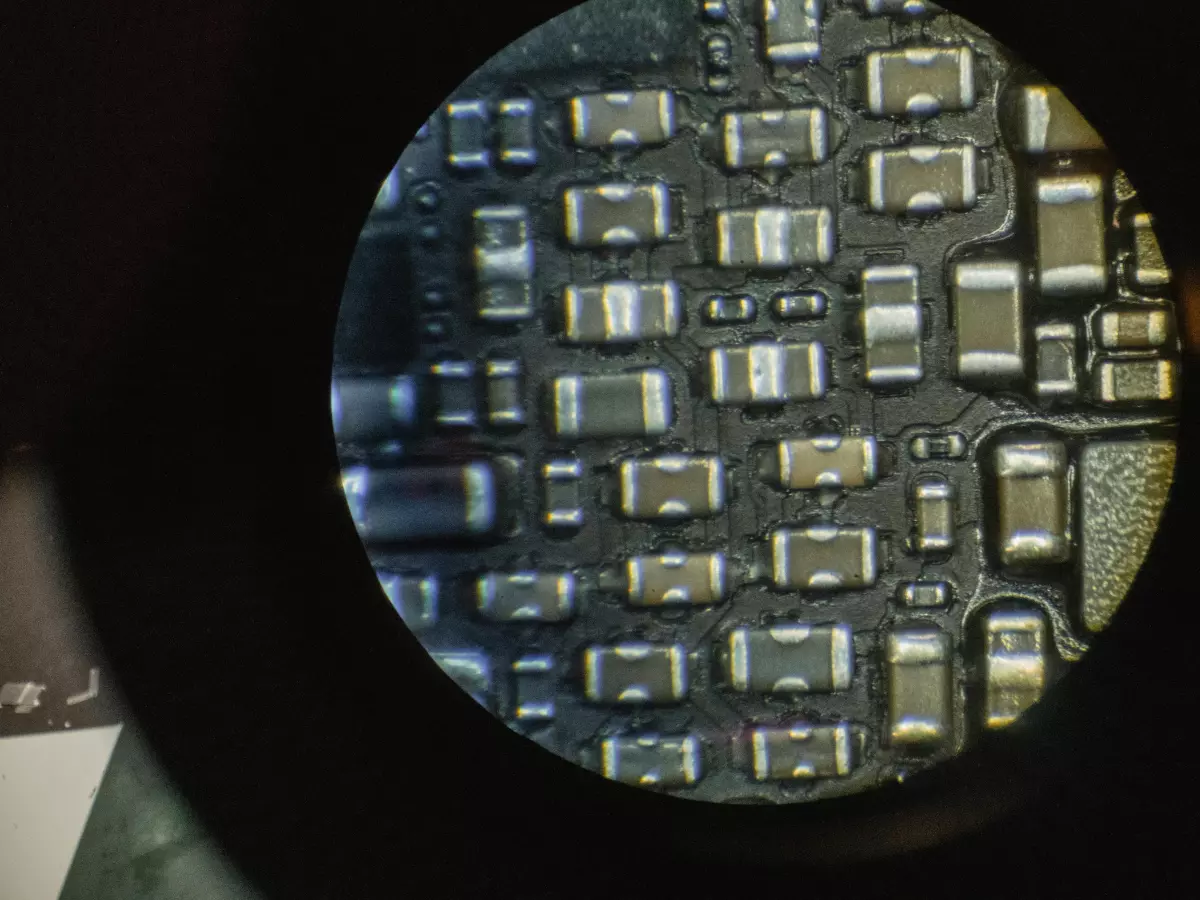 A close-up shot of a microchip, the intricate circuitry and components visible in detail.