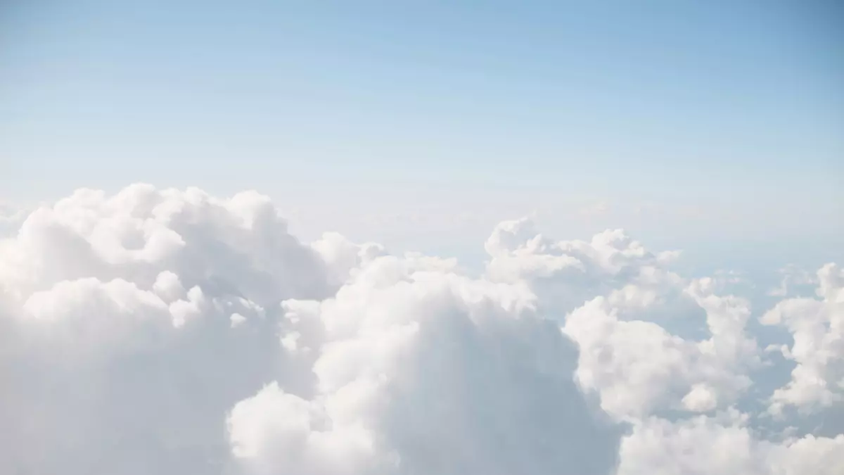 A wide shot of a bright sky filled with white clouds.