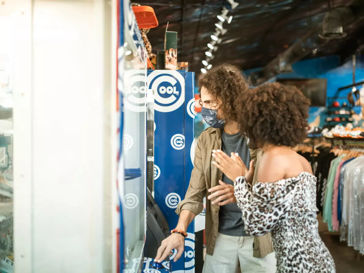 A couple looking at a product in a store.