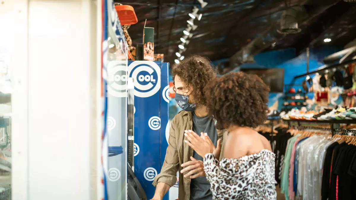 A couple looking at a product in a store.