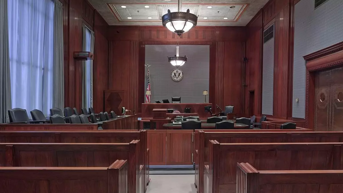 A wide shot of an American courtroom. The camera is facing towards the judge