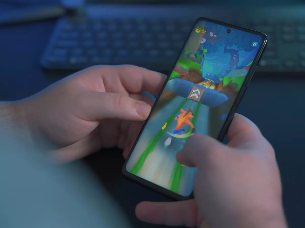 A person is playing a game on their smartphone.