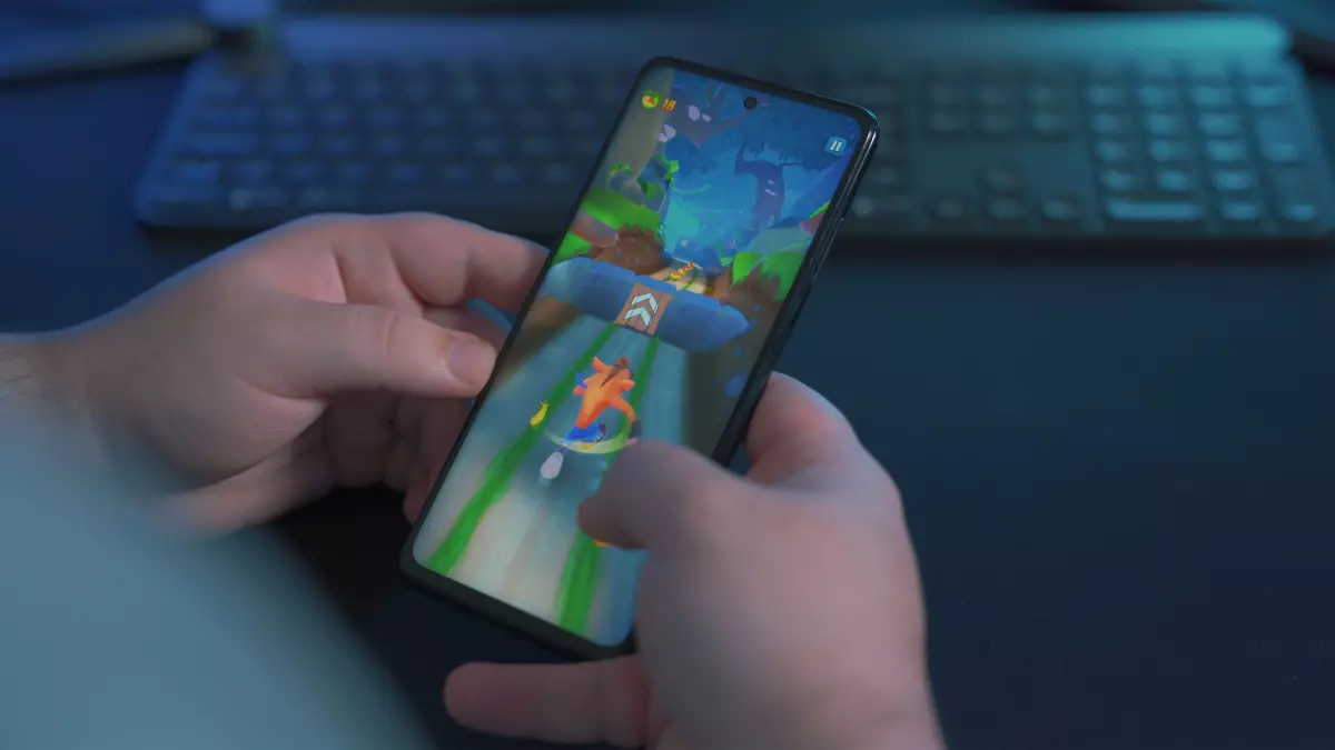 A person is playing a game on their smartphone.