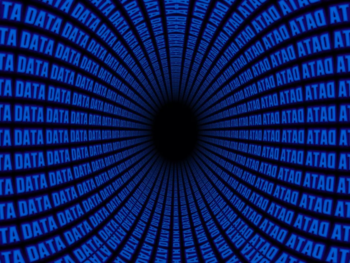 A tunnel of data, with the word 'DATA' repeating in blue, is shown.  The tunnel is surrounded by a black background.