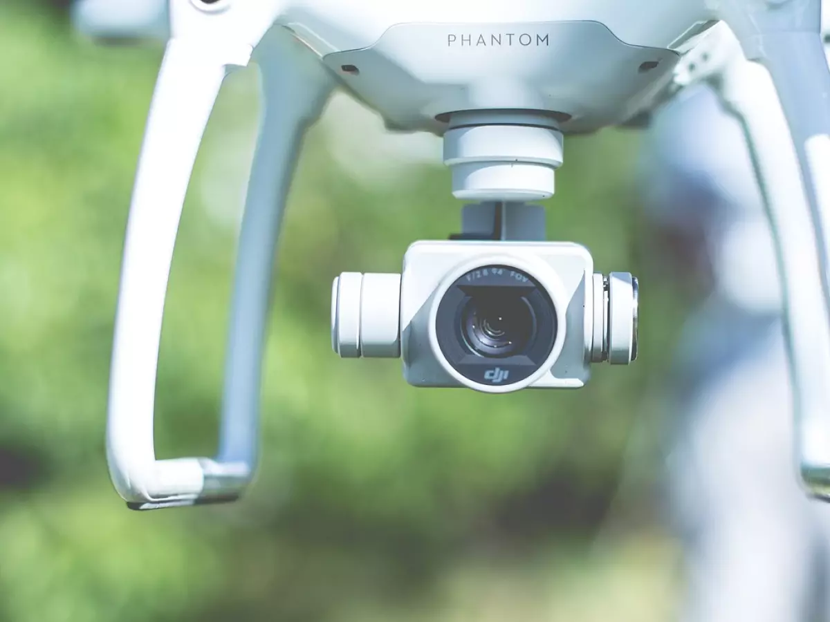 Close-up of a drone's camera with a blurry background.