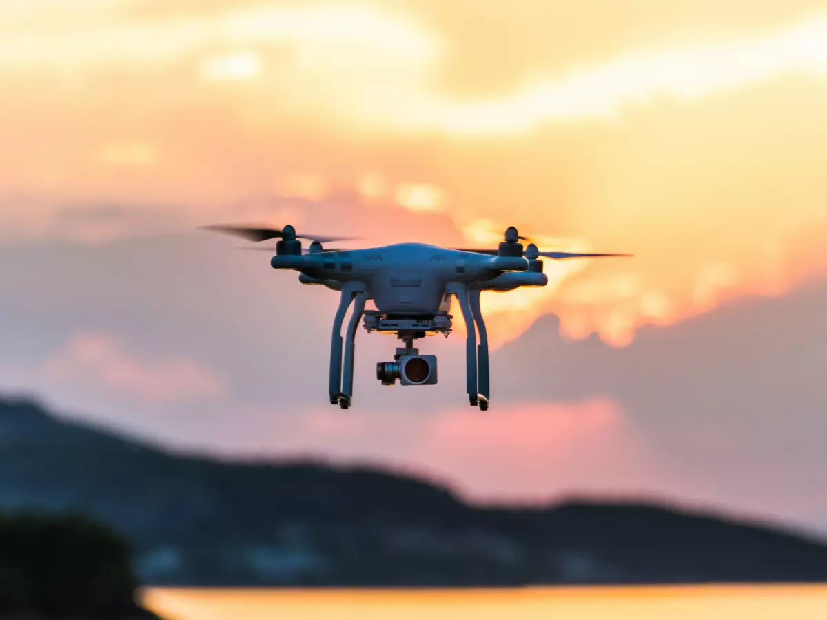 Drone flying at sunset against a beautiful sky.