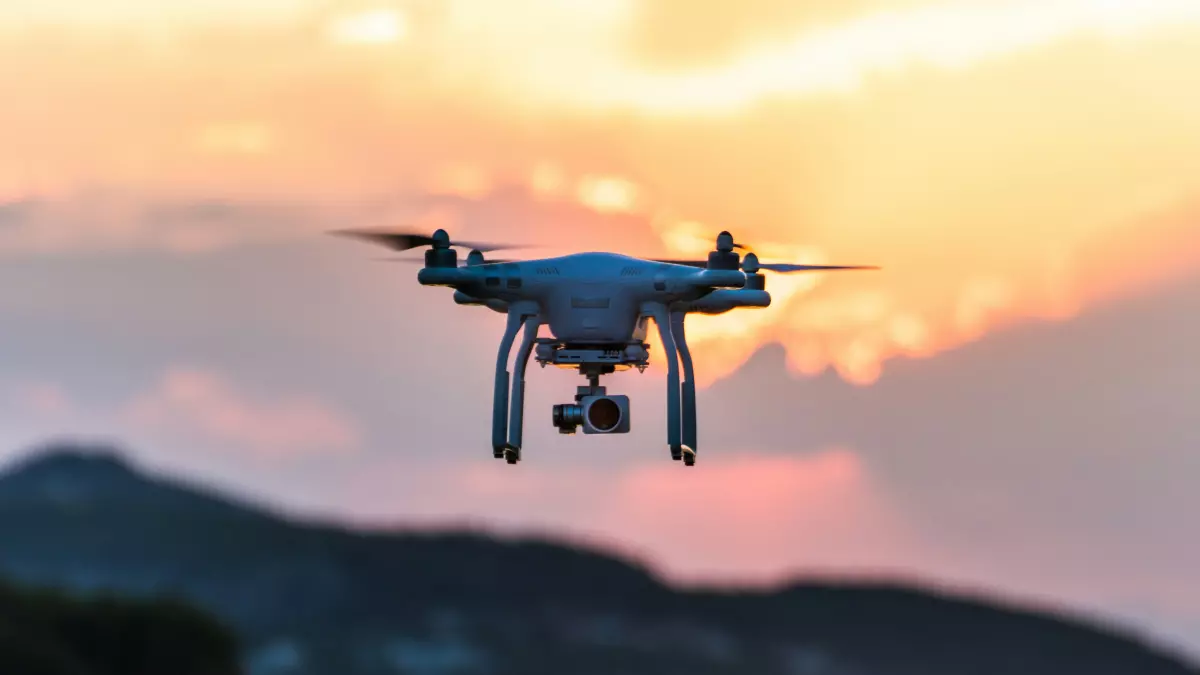 Drone flying at sunset against a beautiful sky.