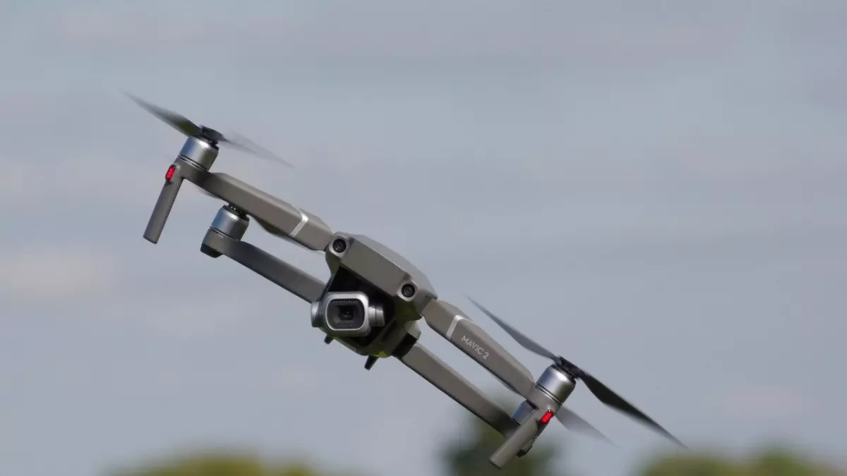 A drone flying in the air, the camera is facing forward.