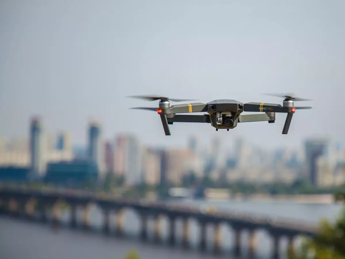 A drone flies over a city.