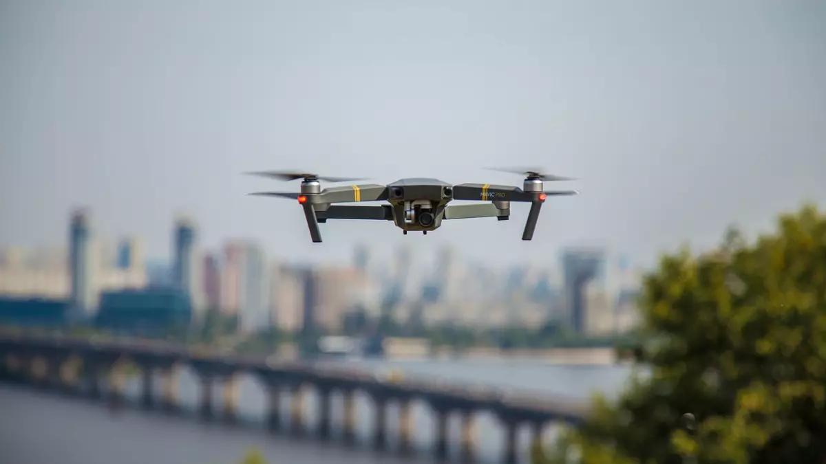 A drone flies over a city.