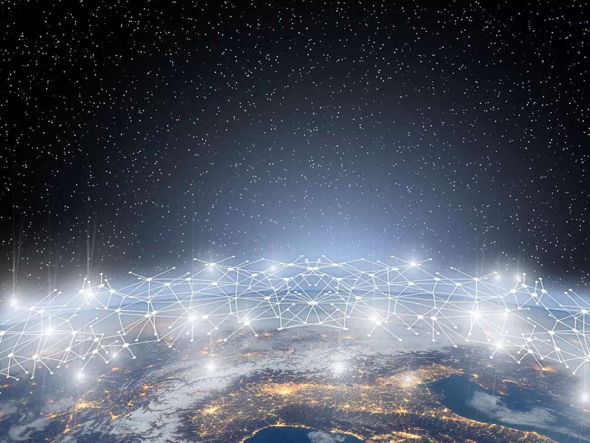 A futuristic depiction of a blockchain network, represented by a network of interconnected nodes against a backdrop of Earth at night.