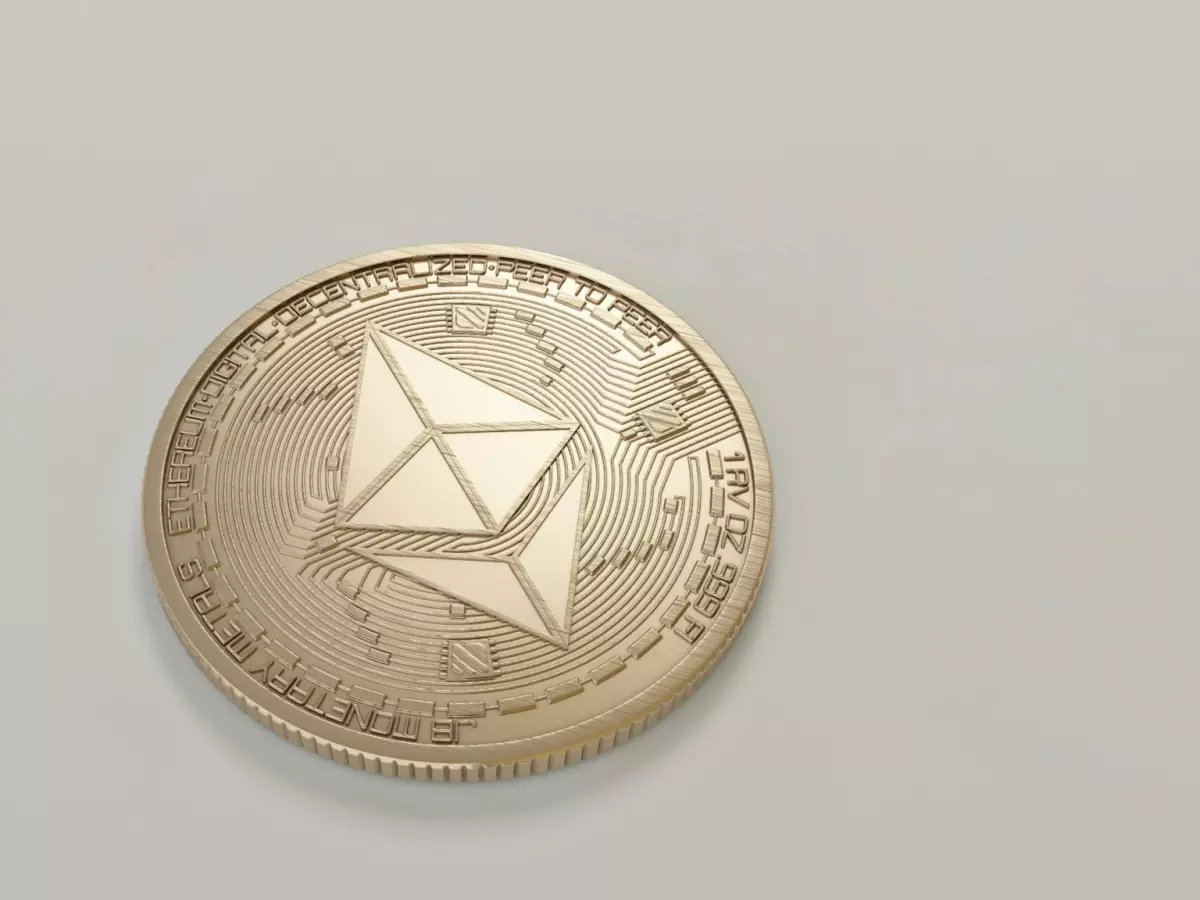 A close-up shot of a Bitcoin coin, the symbol of cryptocurrency, on a white background.