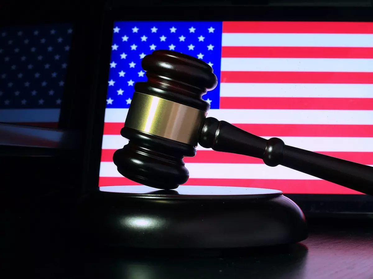 A gavel and an American flag on a tablet