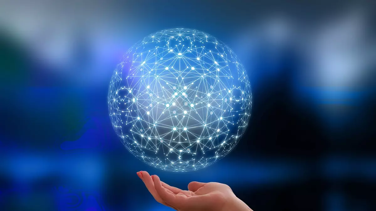 A hand holding a glowing sphere made of interconnected lines and dots, symbolizing a network.