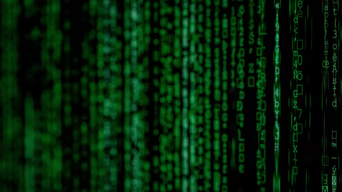 Close-up shot of a cascading green digital code stream against a black background. The image evokes a sense of rapid data movement and complex system processes.