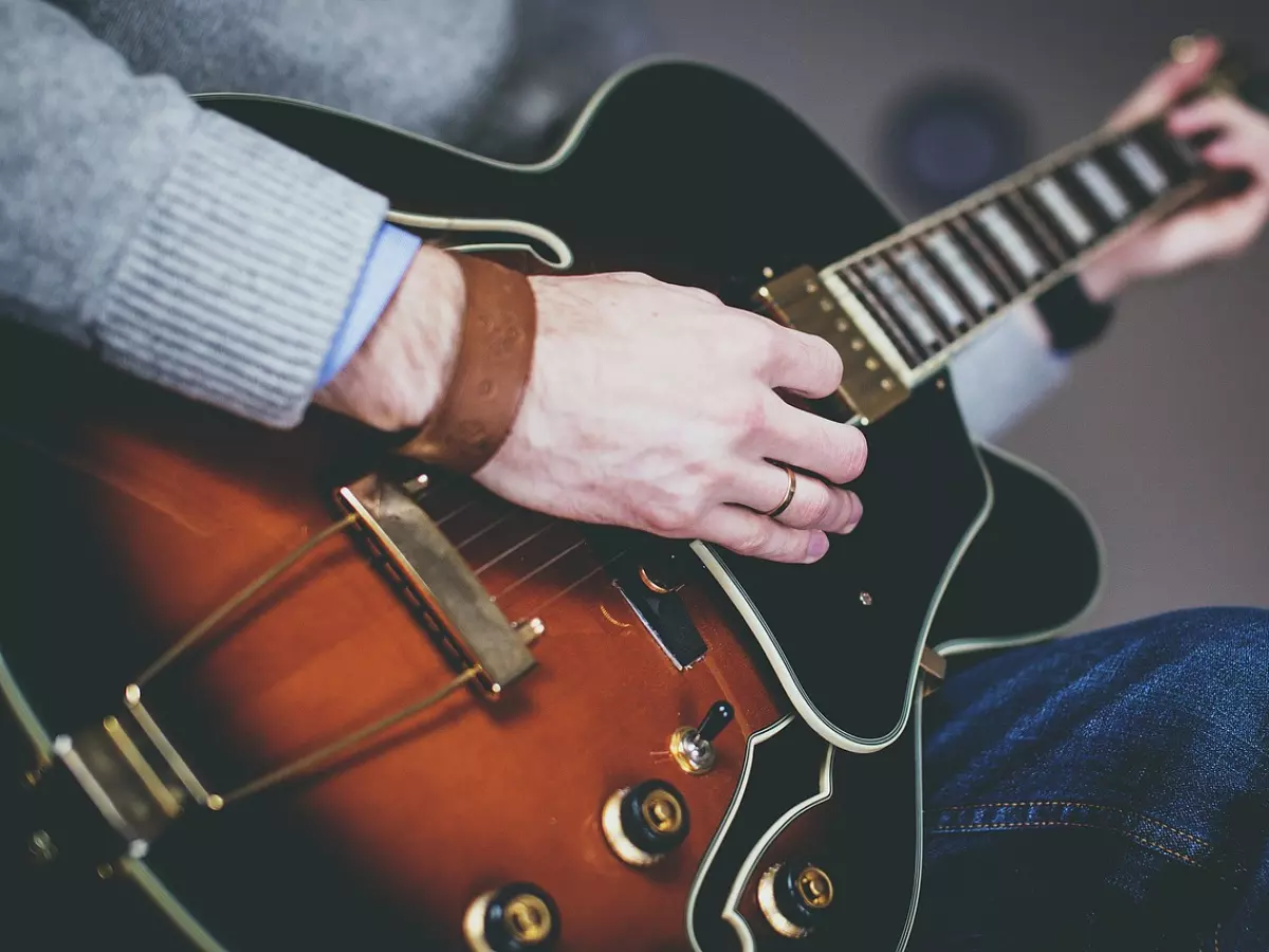 A person playing a guitar