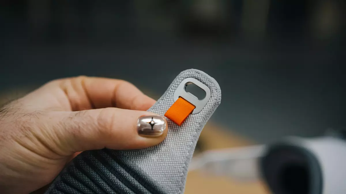 A close-up of the strap of a wearable device, showcasing the fabric texture, stitching, and adjustment mechanism.