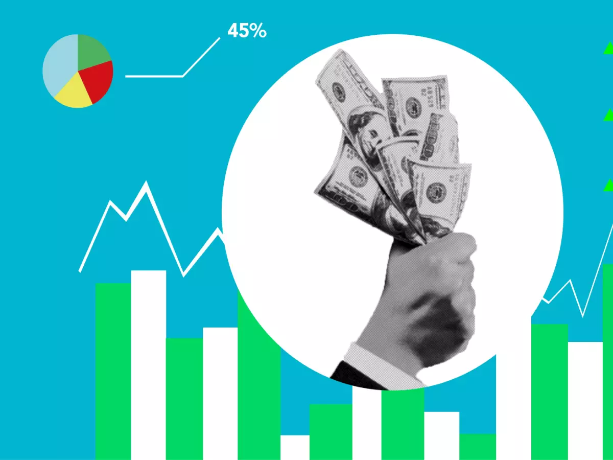 A hand holds a stack of bills, which are surrounded by a circle. Behind it, a graphic with graphs and charts are in black and white.