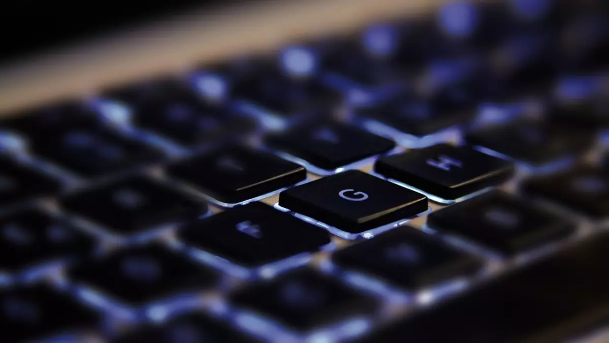 A close-up of a computer keyboard with a glowing G key