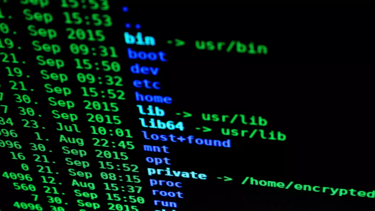 Two white security cameras and a black mouse are displayed on a desk in front of a blurred background of an office.