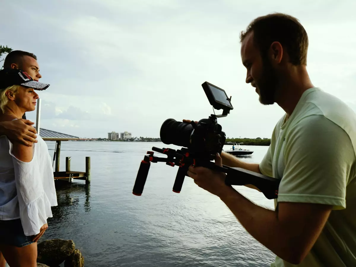 A person filming with a camera on a gimbal