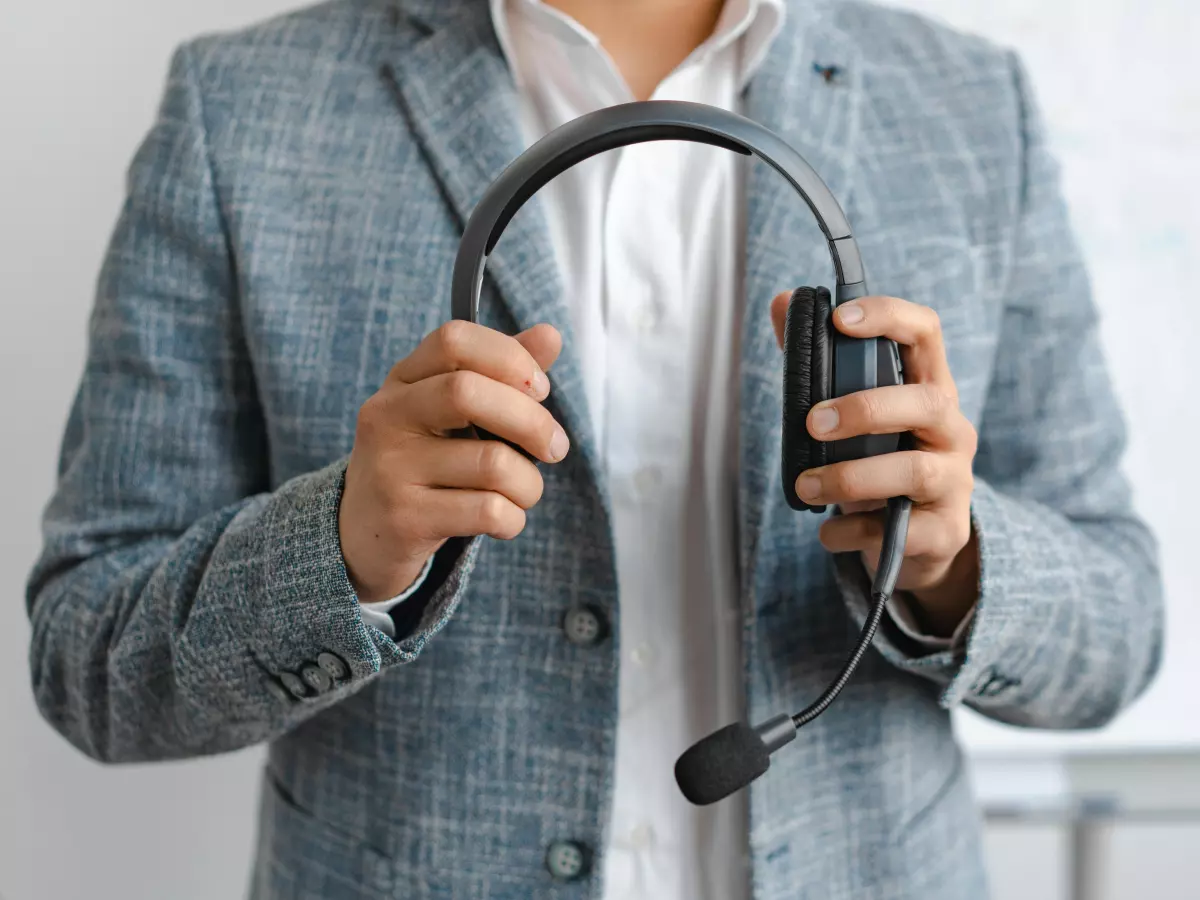 A person holding a headset, a wearable with sensors, demonstrating the integration of technology in everyday life.