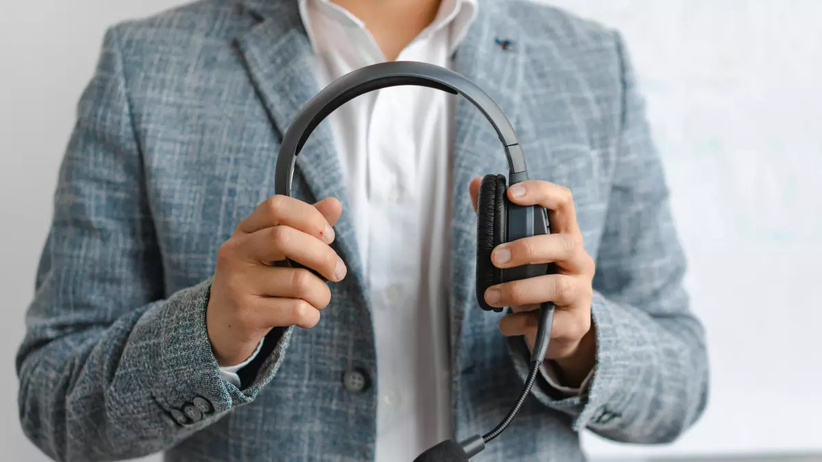 A person holding a headset, a wearable with sensors, demonstrating the integration of technology in everyday life.