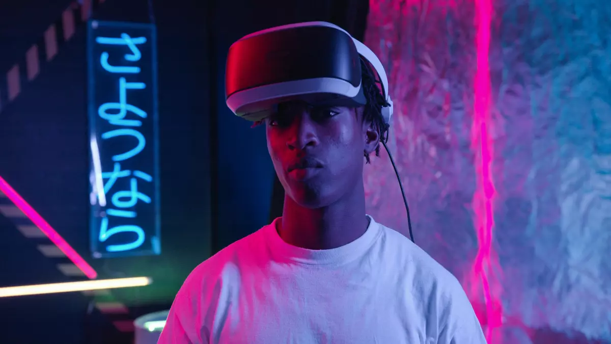 A person wearing a VR headset stands in a dark room with neon lights and signs.