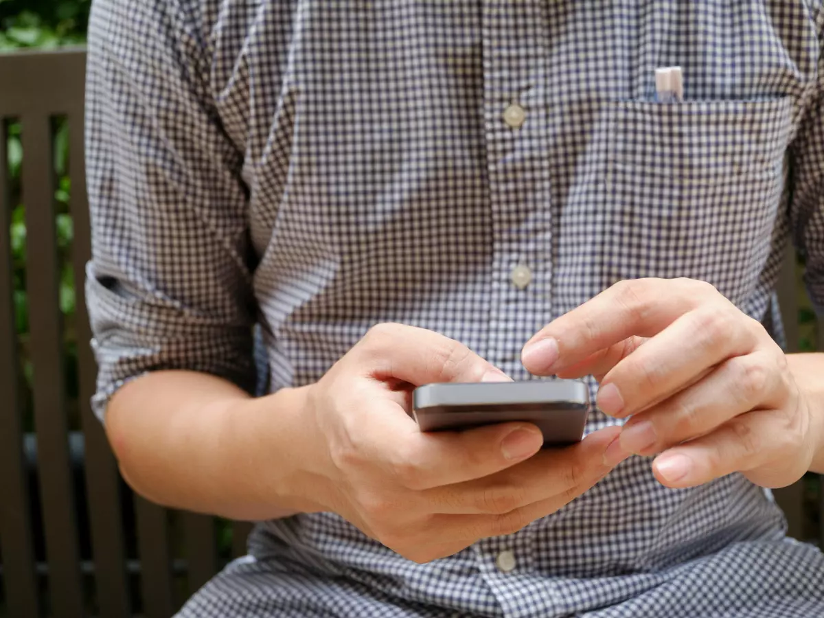 A man is using a smartphone.