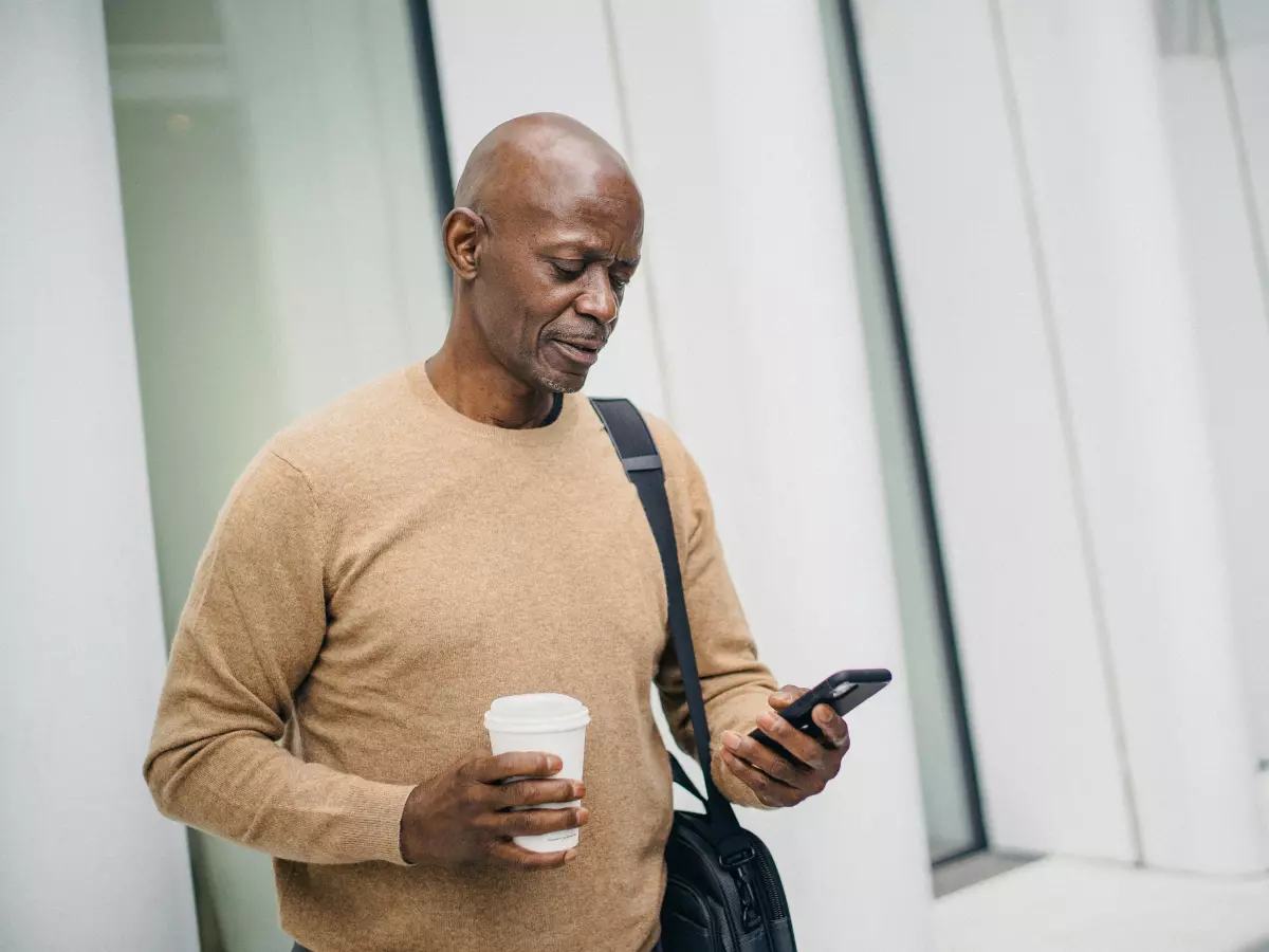 Person holding a smartphone in a professional setting