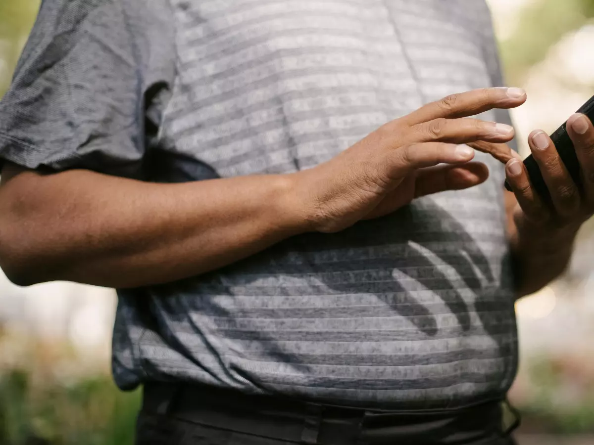 A person is holding a smartphone in their hand.