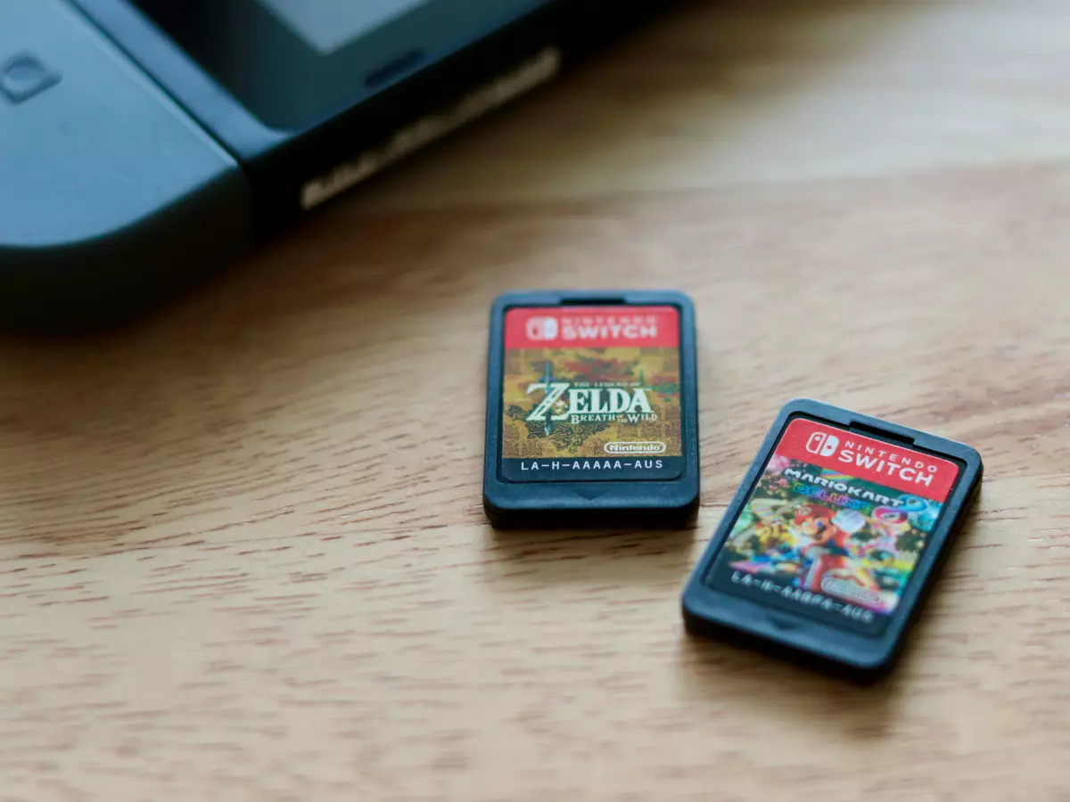 Two game cartridges on a wooden table