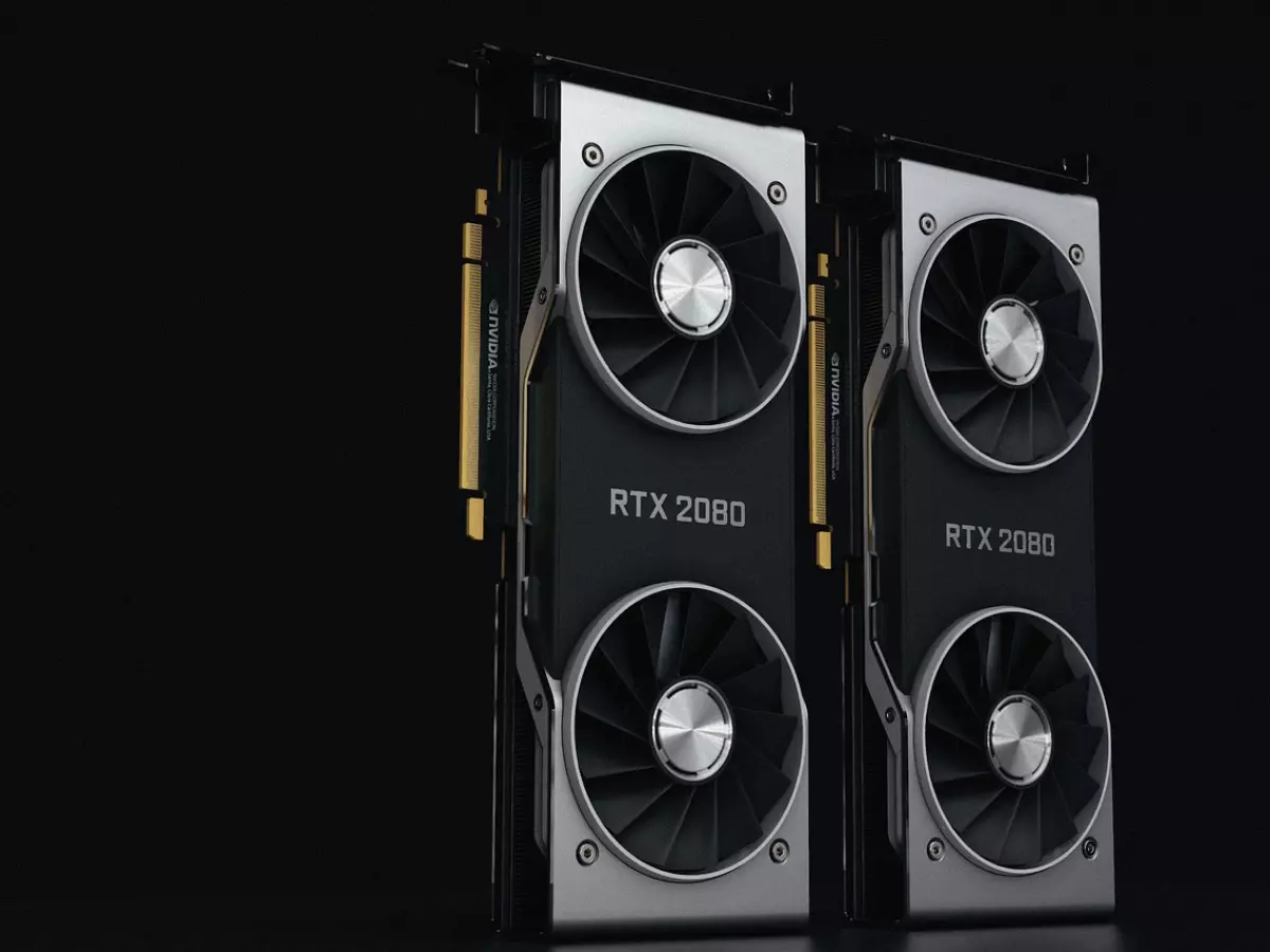 Two Nvidia RTX 2080 graphic cards are placed vertically, side by side, on a black surface.